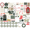 A flat lay of assorted Christmas-themed scrapbook and card-making paper ephemera on a white background, including envelopes, labels, tags, florals, wreaths, and festive text elements.