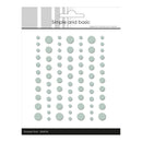 Packaging of 'Simple and Basic' enamel dots with a white background