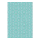 A rectangular sheet of patterned wrapping paper or fabric featuring a repeating white snowflake design on a light aqua background, shown flat against a white backdrop.