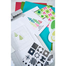 Collection of colorful paper cutouts with geometric patterns and a paper puncher on a white background.