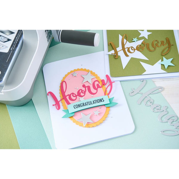 Handmade card with 'Hooray' and 'Congratulations' text on a crafting table.