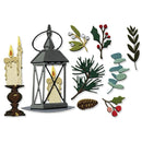 A collection of embroidered holiday and winter-themed appliques on a white background, including a black lantern with a candle, two melting candles, pine branches, holly leaves with red berries, eucalyptus leaves, and a pinecone.