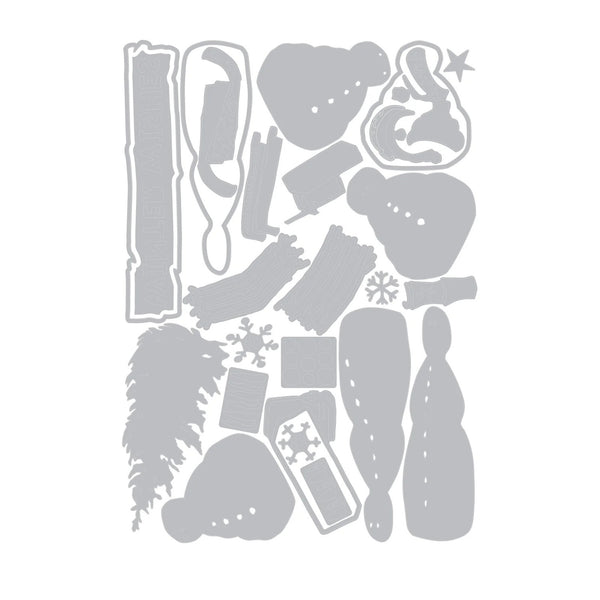 A sheet of gray die-cut craft pieces arranged on a white background, including holiday-themed shapes such as a tree, ornaments, snowflakes, and decorative cutouts.