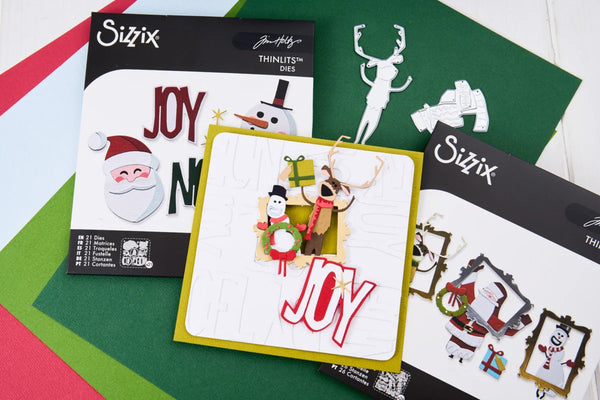Sizix Thinlites Dies holiday crafting kit showing various die-cut paper and metal cutters on a green and white background.