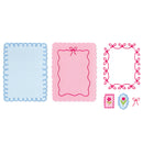 A set of decorative craft or scrapbook paper templates with scalloped and stitched borders, including a light blue square, a pink rectangular frame, a pink ornate border, a small pink flower stamp, and a small blue flower frame.