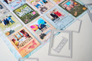 A collection of colorful scrapbook cards and layered photo collage sheets arranged on a white surface, alongside silver metal die-cut frames and a small white card with the text 'I AM ME'.