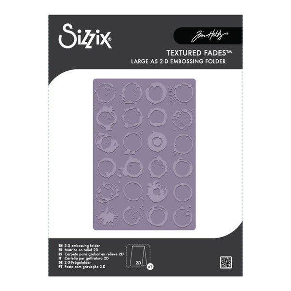 Sizix Textured Fades Large A5 2-D Embossing Folder by Jim Hardy, shown in its retail packaging with a lavender embossed sheet visible through a clear window.