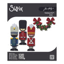 Sizix Thinlits Dies packaging featuring four Christmas-themed paper-cut dies: a blue guard, a red bear-pup style soldier, a red bear soldier, and a holly wreath with red bows. The package is branded with the Sizix logo and Jim Holtz signature.