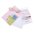 Speedy Carve stamp carving set by Speedball, featuring a white-handled carving tool, a pink stamp block, a metal stamp, and an instruction booklet on a white background.