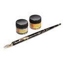 A black and gold marbled fountain pen with a gold nib, shown alongside two small jars of gold and silver ink on a clean white background.