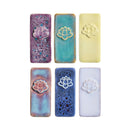 Six rectangular ceramic tiles with embossed lotus flowers, arranged in a 2x3 grid on a white background. The tiles feature various glazed colors including purple, teal, pale yellow, blue, and lavender.