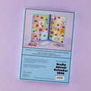 Spellbinders Crafty Advent Calendar 2026 packaging box shown against a light purple background. The front of the box features a colorful illustration of the opened calendar with numbered doors and decorative details, and text describing 24 crafty surprises inside.