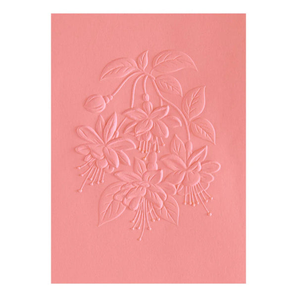 Pink card with floral embossing on a white background