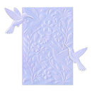 Decorative embossing folder with bird and floral designs on a light blue background
