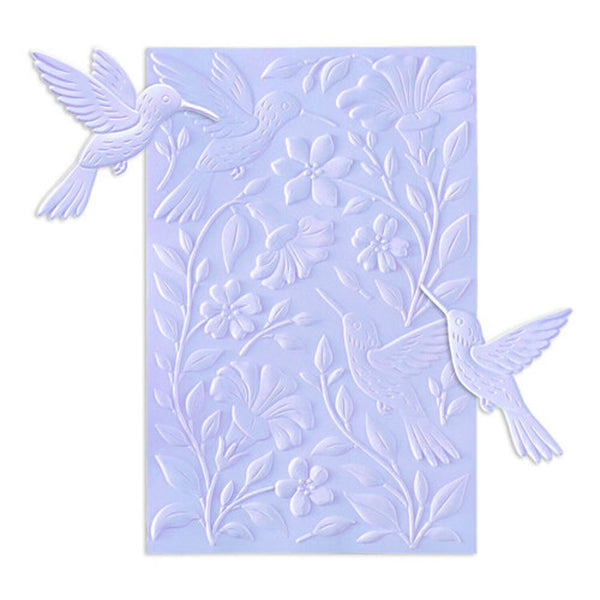 Decorative embossing folder with bird and floral designs on a light blue background