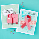 Two handmade cards on a turquoise background, one with a pink suitcase and the other with a pink ribbon and 'Hope' text.