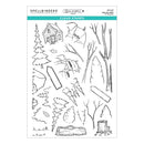 Set of clear stamps with nature-themed designs including trees, a cabin, and animals on a white background.