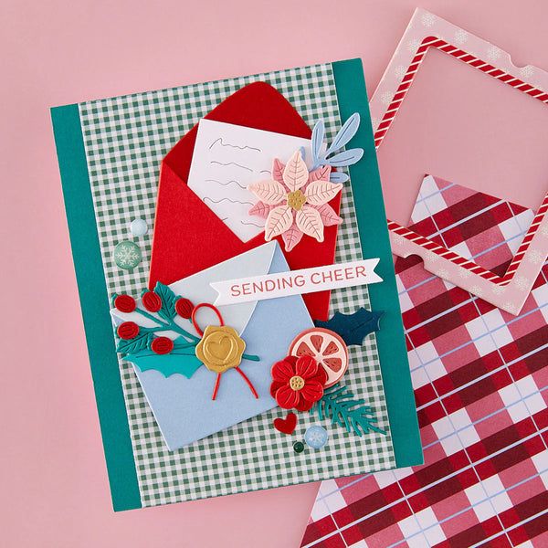 Handmade Christmas card with decorative elements on a pink background