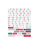 A sheet of decorative alphabet stickers with holiday-themed words and phrases in red, teal, and pink on a white background.