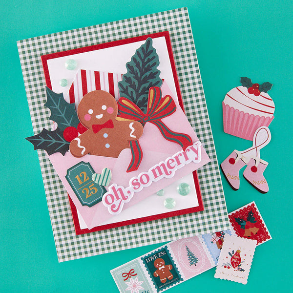 Christmas-themed card with gingerbread man and festive decorations on a checkered background