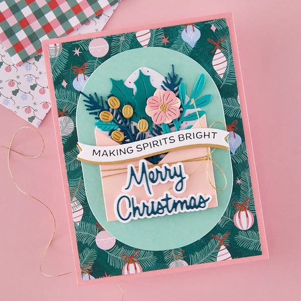 Christmas card with festive design and text on a pink background