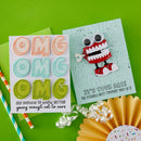 Colorful 'OMG' card and a card with a robot design on a green background