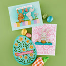 Two Easter-themed greeting cards with decorative eggs and a carrot on a green background.
