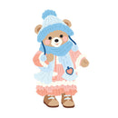 A cute cartoon teddy bear wearing a light blue knit hat with ear flaps, a matching blue scarf, a pink dress with white lace trim, and brown boots, shown on a plain white background.