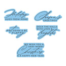 Five holiday-themed die-cut sticker designs with light blue backgrounds and dark blue text, arranged on a plain white background. The phrases include 'Holiday Hugs From Home,' 'Season's Greetings,' 'Eat, Drink & Be Merry,' 'Deck The Halls With Love & Laughter,' and 'We Wish You A Very Merry Christmas & A Happy New Year.