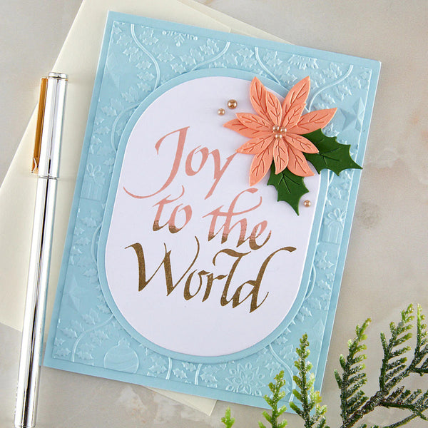 Christmas card with 'Joy to the World' text and poinsettia flower on light blue background