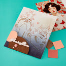 Decorative paper with butterfly designs on a teal background