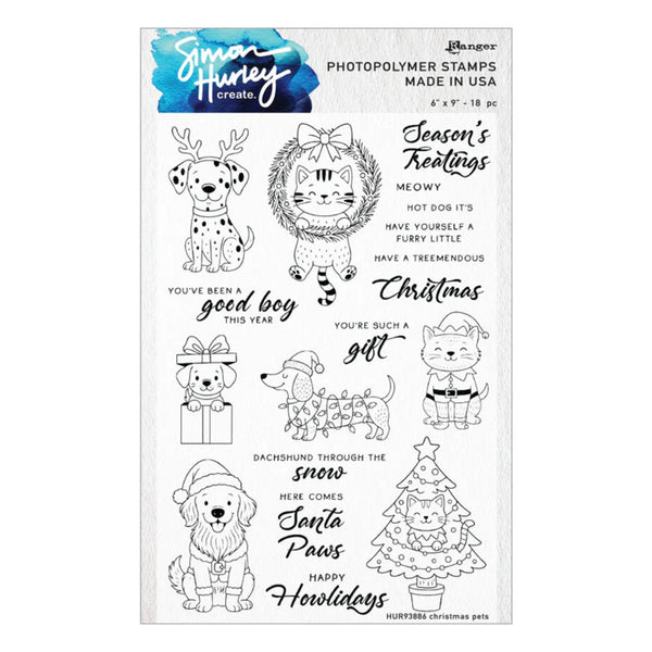 A sheet of clear photopolymer stamps featuring Christmas pet illustrations and holiday phrases, branded Smart Honey Create and Mangée. The designs include a Dalmatian, a cat in a wreath, a dachshund in the snow, a Christmas tree, and text stamps like 'Season's Treations', 'You've been a good boy this year', and 'Santa Paws Happy Holidays'.