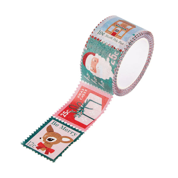 A roll of Christmas-themed washi tape with a strip unrolled, featuring festive postage stamp designs with Santa Claus, a reindeer, a gift box, and holiday text on a white background.