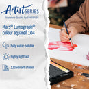 Promotional graphic for Artist Series Mars Lumograph colour aquarell 104 watercolor paint. The left side features a torn-paper overlay with blue text detailing product features: 'Fully water-soluble', 'Highly lightfast', and '120 vibrant shades'.