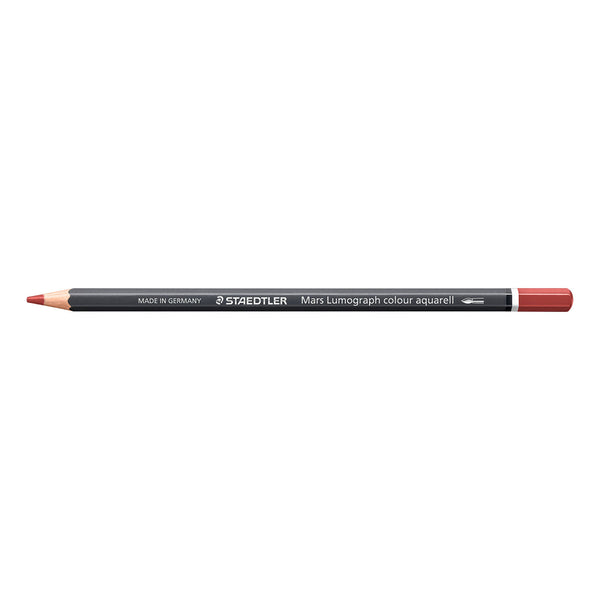 A Staedtler Mary Lumograph colour aquarell drawing pencil with a dark gray barrel, a bright red tip, and a red end cap, shown horizontally on a plain white background.