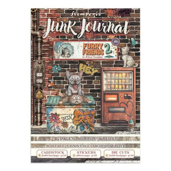 Stamperia 'Junk Journal' scrapbooking paper cover featuring a vintage-style illustration of a brick wall, a vending machine, a cat on a counter, and graffiti details, with product details printed along the bottom.