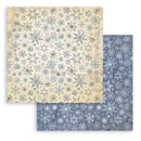Two sheets of paper with snowflake patterns, one beige and one blue.