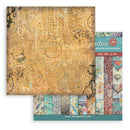 A scrapbooking and mixed media paper pack from Stamperia, featuring a large textured gold-toned sheet with distressed patterns and a row of colorful patterned paper samples along the side.