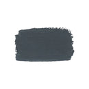 A textured, rectangular paint swatch of dark charcoal gray with visible brushstrokes, centered on a solid white background.