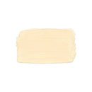 A textured, rectangular swatch of cream-colored cosmetic cream or paint on a solid white background.