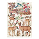 Sheet of die-cut Christmas-themed paper with reindeer, sleigh, and other festive elements on a white background.
