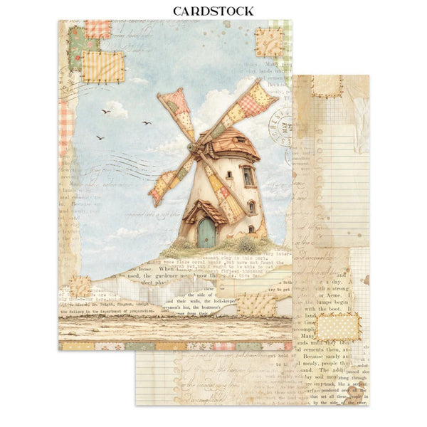 A sheet of decorative cardstock featuring a vintage French countryside design with a windmill, patchwork borders, cursive handwriting, and a warm beige background. A second overlapping sheet is visible on the right, showing lined paper and more patterned details.
