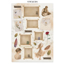 A sheet of decorative stickers with a vintage Spanish aesthetic, featuring multiple beige photo frames, envelopes, leaves, flowers, and illustrated figures, with labels in English and Spanish.