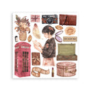 A sheet of watercolor-style decorative stickers or clipart elements on a white background, including a pink telephone booth, flowers in a vase, a camera, a woman reading, a leather pouch, a suitcase, a round hatbox, a film strip, lipstick, and other vintage-inspired motifs.