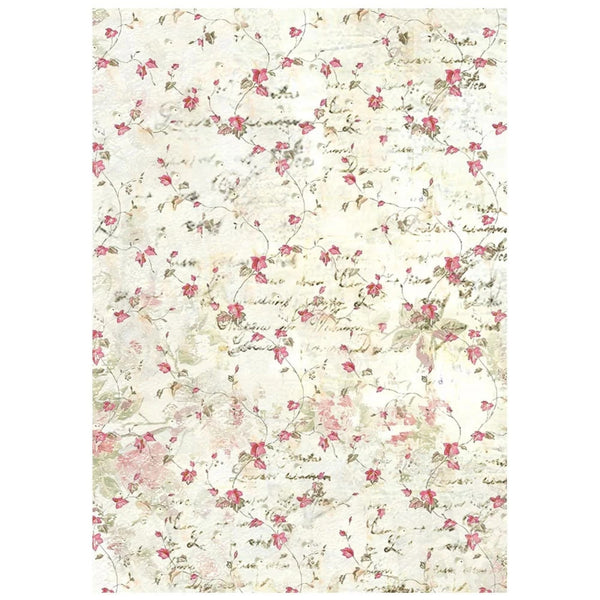 A rectangular area rug with a vintage-style floral pattern featuring pink roses, green leaves, and cursive script on a distressed cream background.