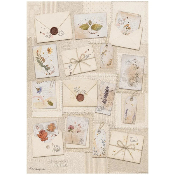 A collage of vintage-style paper envelopes, tags, and cards with botanical illustrations, wax seals, ribbons, and dried flower motifs on a cream patchwork background.