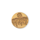 A round gold-colored metal coin or medallion featuring a paw print above stylized gothic text that appears to read 'FRIENDS' backwards, shown on a plain white background.