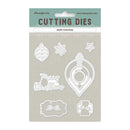 A package of Stamperia Merry Christmas cutting dies, featuring six white metal die shapes including ornaments, a train, and decorative frames on a light gray backing card with a teal header.