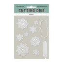 Stamperia cutting dies set for 'Snowfall' in its original packaging, featuring white metal snowflake and frame-shaped dies on a textured beige backing card with a teal header.