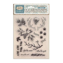 White Christmas Stamperia clear stamps set in its original packaging, featuring pinecones, antlers, paw prints, footprints, branches, and winter-themed phrases on a beige backing sheet.
